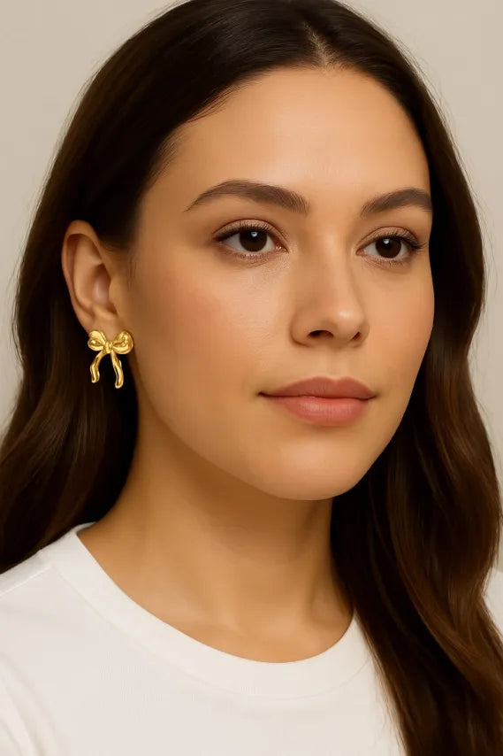 Gouden strikjes oorbellen - stainless steel