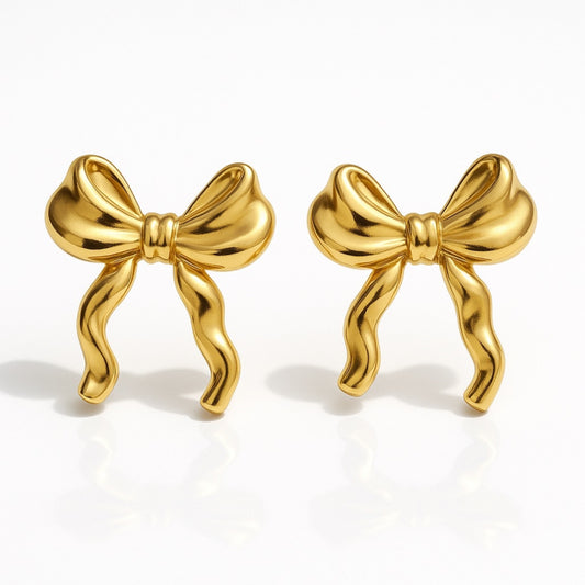 Gouden strikjes oorbellen - stainless steel